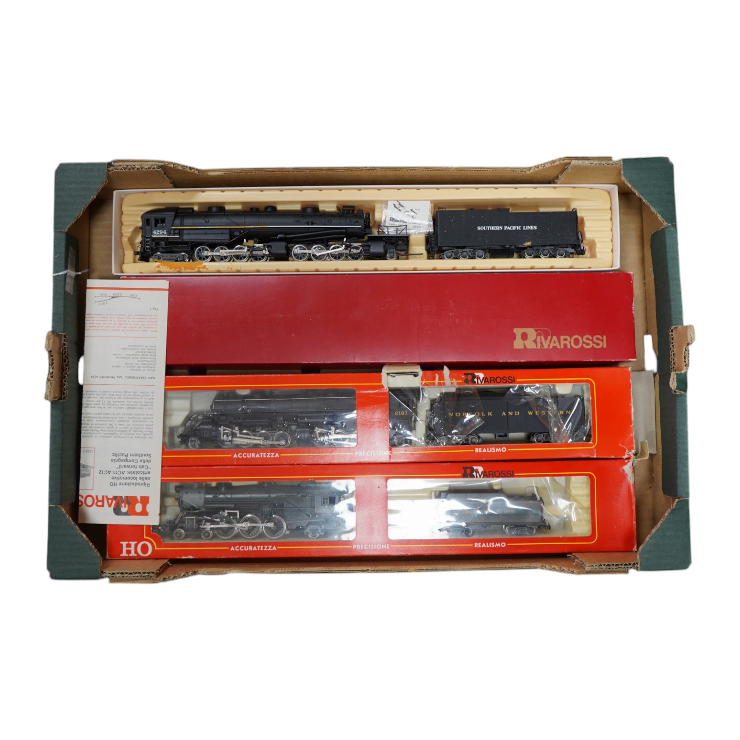 Three boxed Rivarossi HO gauge railway American outline tender locomotives; a Southern Pacific Lines 2-8-8-4, 4294, (1547), a Norfolk and Western 2-8-8-2, 2197, (1238), and a B&O 4-6-2, President Fillmore, (1540). Condit